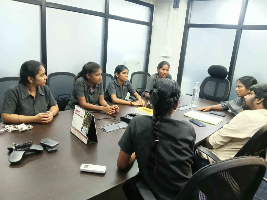 Professors Interacting with Engineering Interns in Conference Room